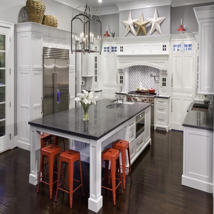 Bay Area kitchen remodeling contractor modern design with white cabinetry, dark countertops, and red bar stools